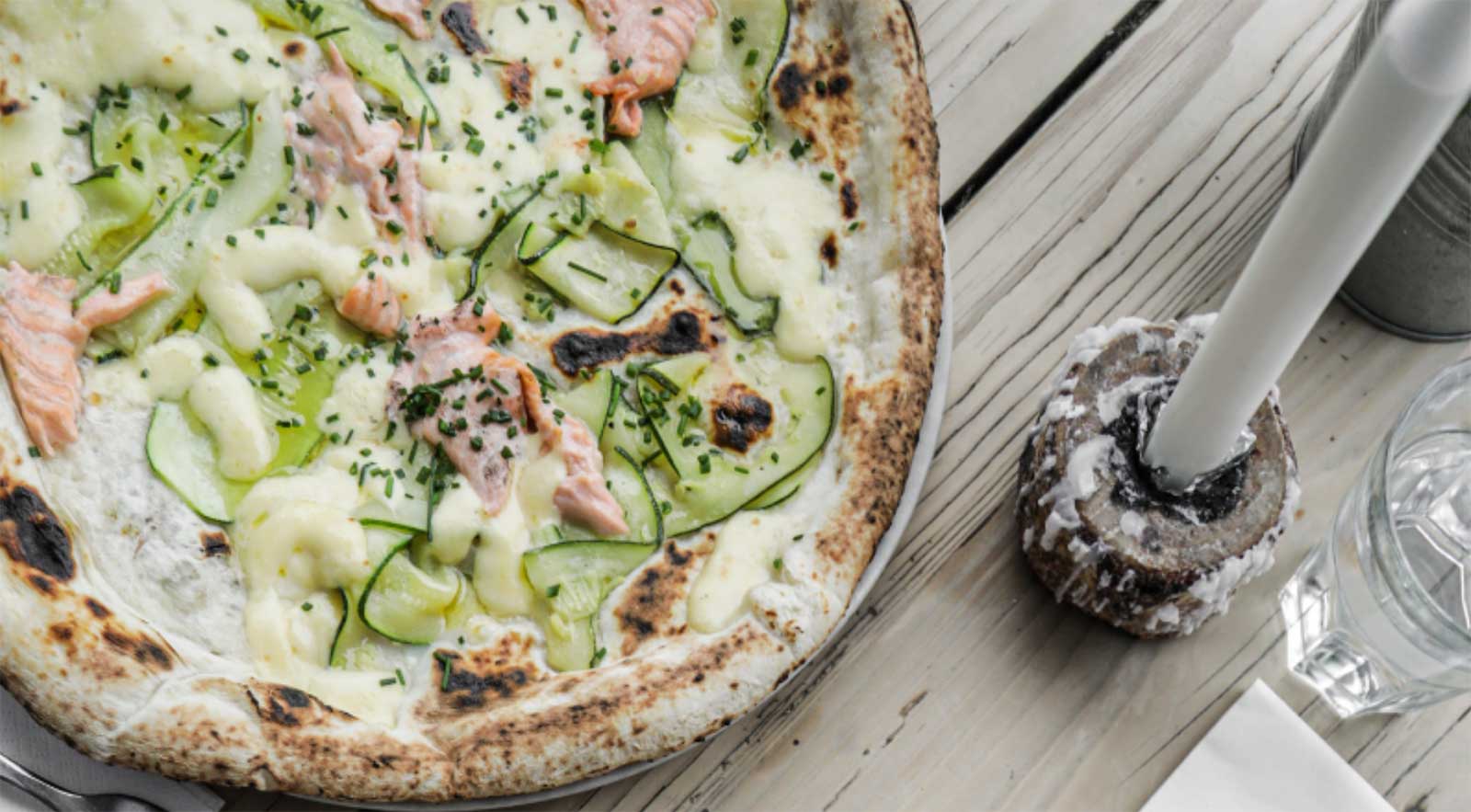 alfredo sauce on homemade pizza seafood and cucumbers