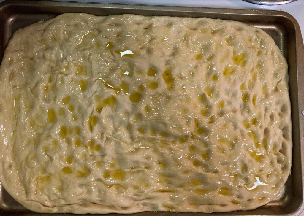 oiled up dough before the focaccia art