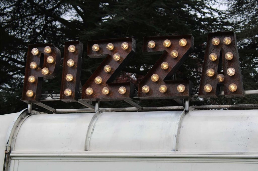old pizza sign