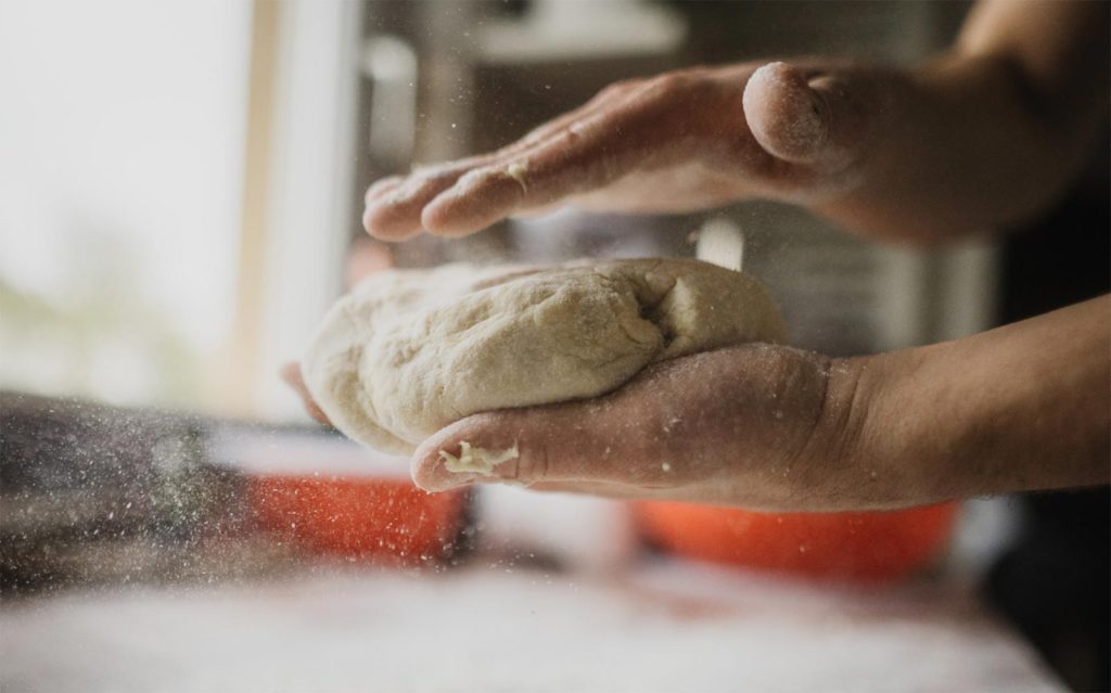homemade gluten-free pizza dough kneading