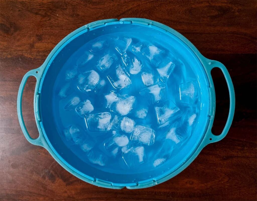thawing frozen pizza dough in ice cold water bowl