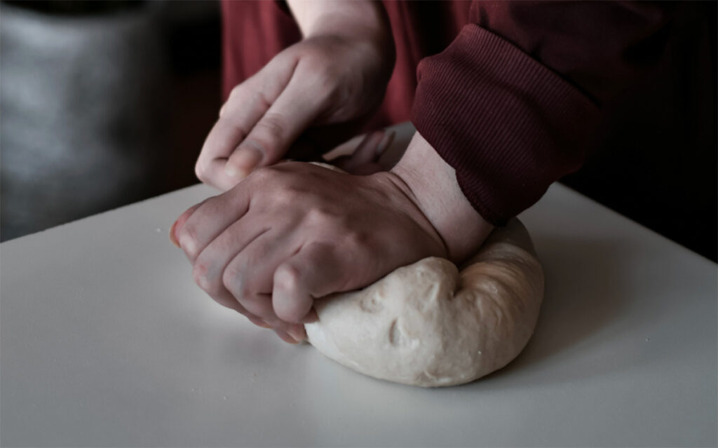 kneading the pizza dough