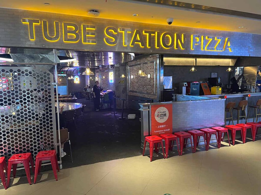 tube station pizza review outside the restaurant