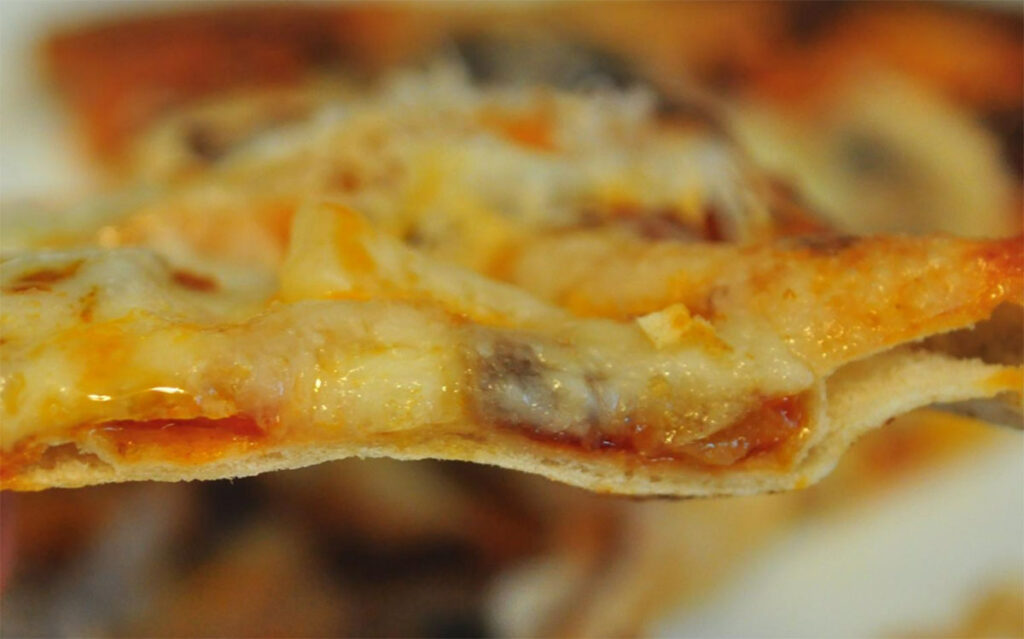 close-up photo of homemade thin crust pizza